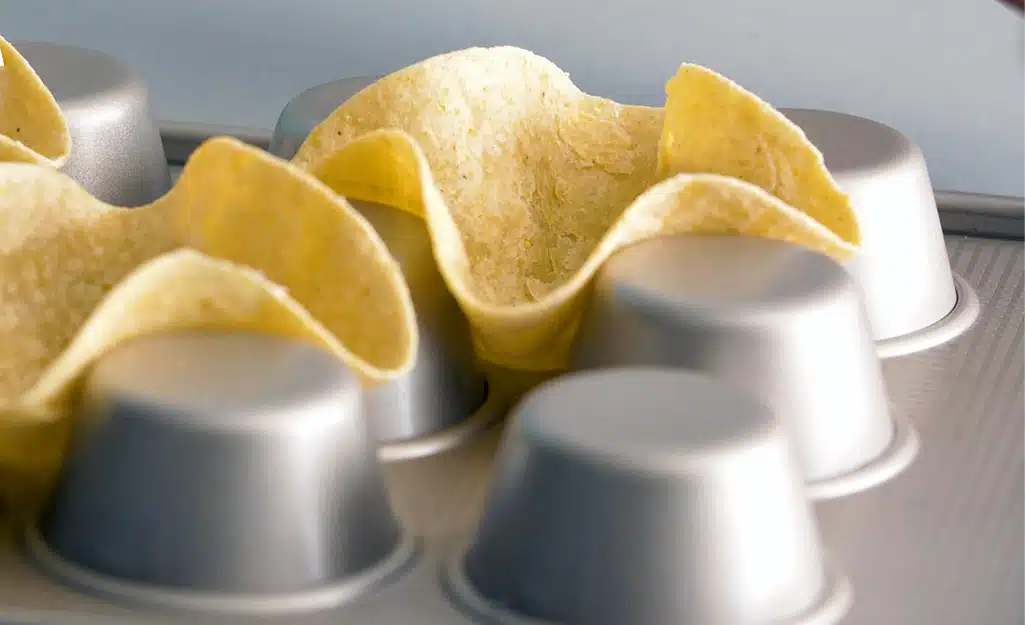 Home Depot helps show us other ways to use a muffin tin to make mini tortilla shells