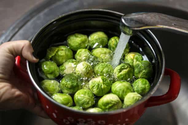 Wash Brussels sprouts thoroughly with Earth’s Natural Fruit & Vegetable Wash