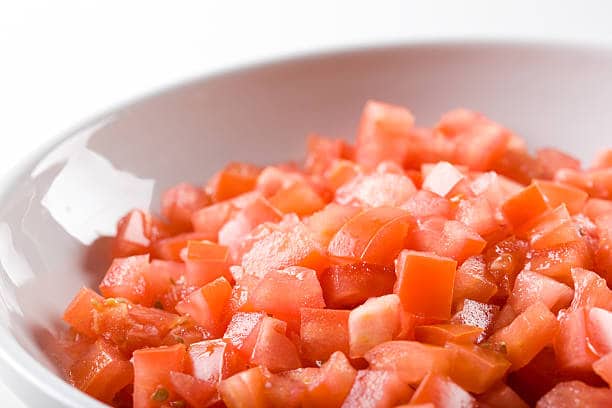Put chopped or diced tomatoes into the bowl for the Farr Better Black Bean Corn Salza Recipe