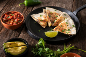 Smother the Black Bean Corn Salsa inside and outside of a Quesadillas.