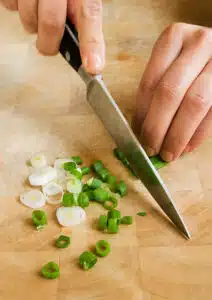 Chop the green onions for the Farr Better Black Bean Corn Salza Recipe